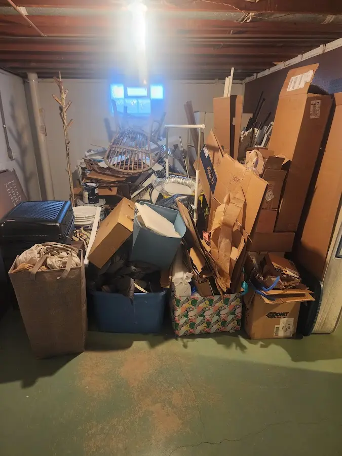 Roll-off dumpster container at job site for Cleanout Dumpster Rental in Burton